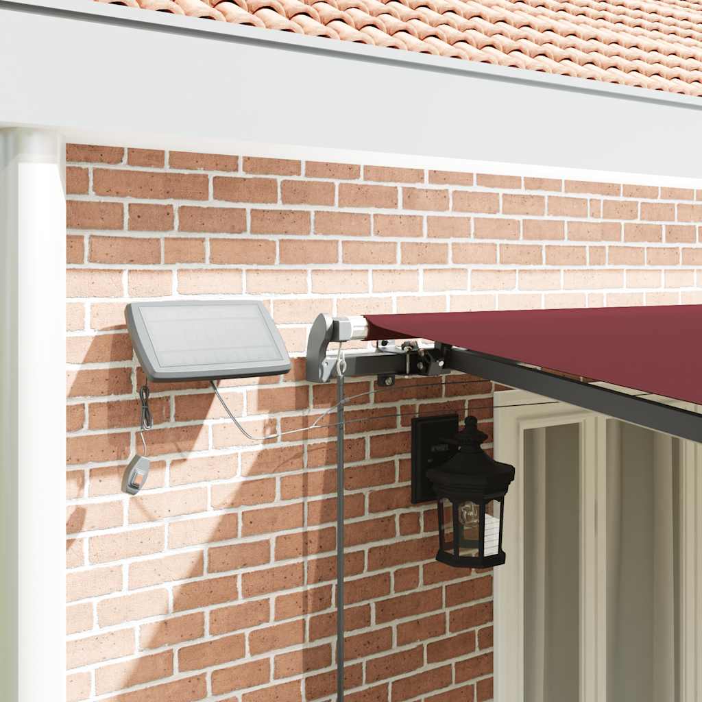 Tenda na ručno uvlačenje s LED svjetlima bordo 600 x 300 cm